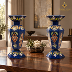 Two six-sided lapis and semi-precious stone mosaic vases styled on a polished walnut dining table