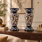 Six-sided mosaic vase pair displayed on a dark walnut console in an elegant interior.
