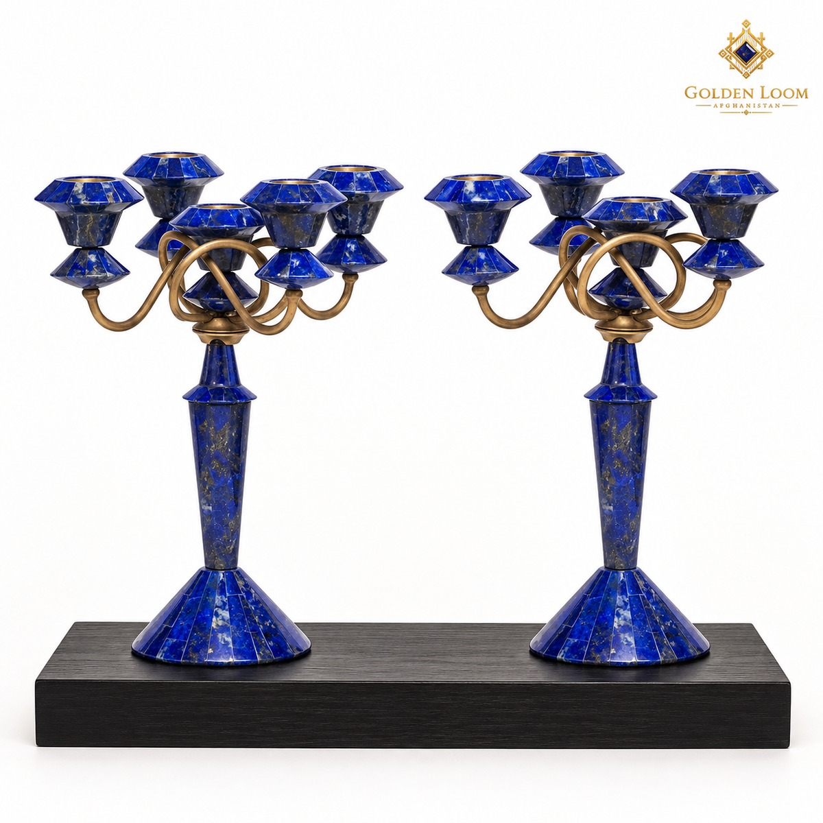 Pair of five-light lapis lazuli and brass candelabra displayed on a black wooden plinth