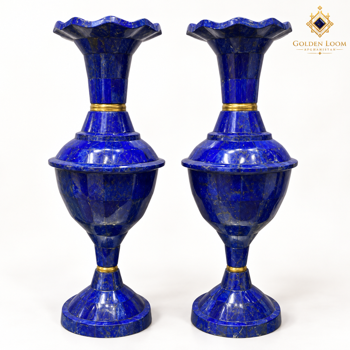 Two blue lapis lazuli vases with scalloped rims and brass accents on a white background.