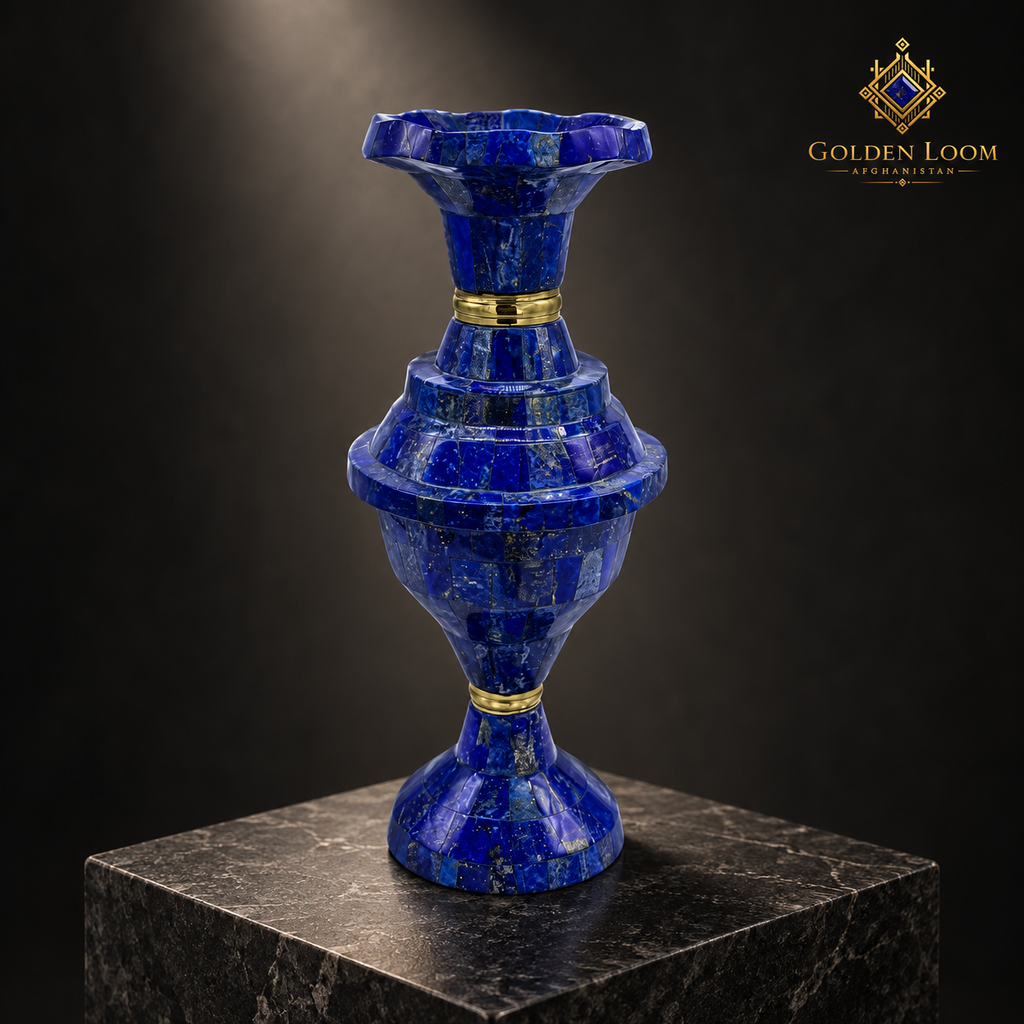 Close-up of a handcrafted Imperial lapis lazuli vase displayed on a dark stone pedestal.