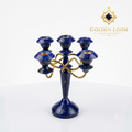 Handcrafted Afghan lapis lazuli five-arm candelabra with interlocking brass frame, angled view on white background — Golden Loom Afghanistan decorative gemstone candle holder
