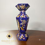 Handcrafted Afghan lapis lazuli mosaic vase with natural stone chip inlay featuring bird and floral motifs, displayed on a wooden surface — Golden Loom Afghanistan luxury decorative art