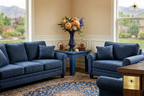 Hand-carved lapis lazuli vase with peach ranunculus on a side table in a contemporary blue living room with Afghan carpet — Golden Loom Afghanistan