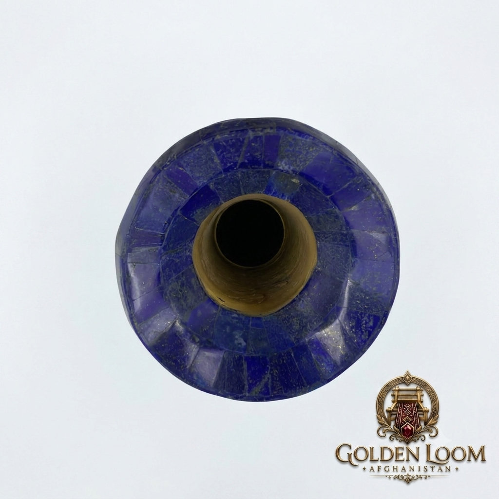 Top-down view of Afghan lapis lazuli vase showing mosaic stone inlay pattern and solid brass core opening, white background