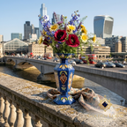 Golden Loom Afghanistan lapis lazuli mosaic vase with wildflowers and poppies on London Bridge parapet with City of London skyline — handmade Afghan gemstone decorative vase, luxury gift