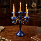 Handcrafted Afghan lapis lazuli five-arm candelabra with brass frame, lit with candles on a wooden desk in a classic library — Golden Loom Afghanistan luxury home décor