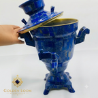 Handcrafted Lapis Lazuli Samovar with brass rim lid being opened, showing deep blue gemstone mosaic surface — Golden Loom Afghanistan