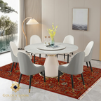 Traditional Afghan red floral rug styled under a round white marble dining table with gold-accented chairs in a contemporary interior — Golden Loom Afghanistan