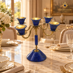 Handcrafted lapis lazuli and brass candelabrum displayed in an Afghan heritage-inspired interior.