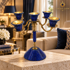 Afghan lapis lazuli five-arm candelabrum on a travertine table in a luxury hotel lounge.