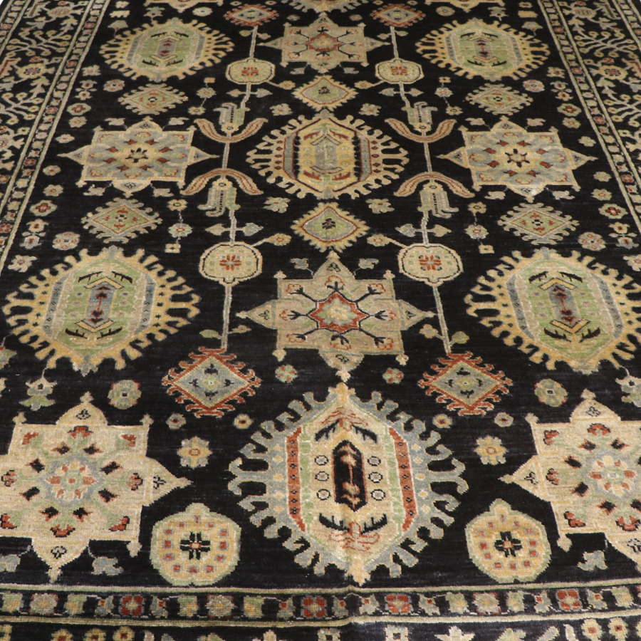 The Mazar-e-Sharif Vase Legacy highlighting its hand-knotted pattern, natural wool and artisan craftsmanship.
