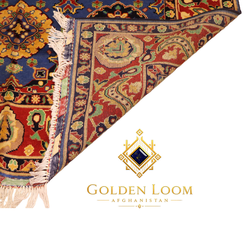 Close-up of Afghan hand-knotted Mamluk carpet corner showing dense wool pile, ivory fringe, and intricate floral border in crimson, navy, and gold — Golden Loom Afghanistan