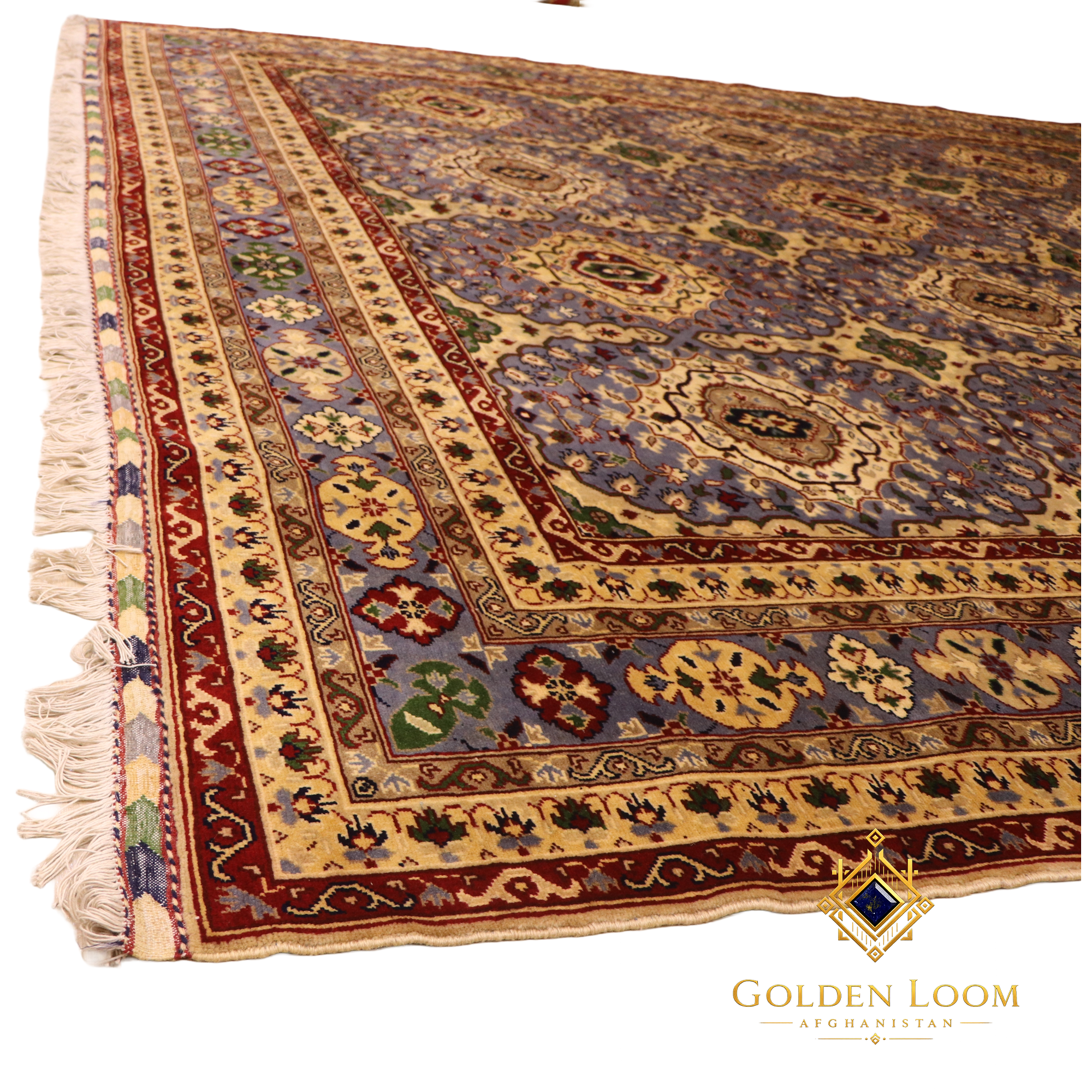 Corner detail of a hand-knotted Afghan rug showing layered ivory and crimson borders with floral motifs, slate blue field, and hand-tied ivory fringe