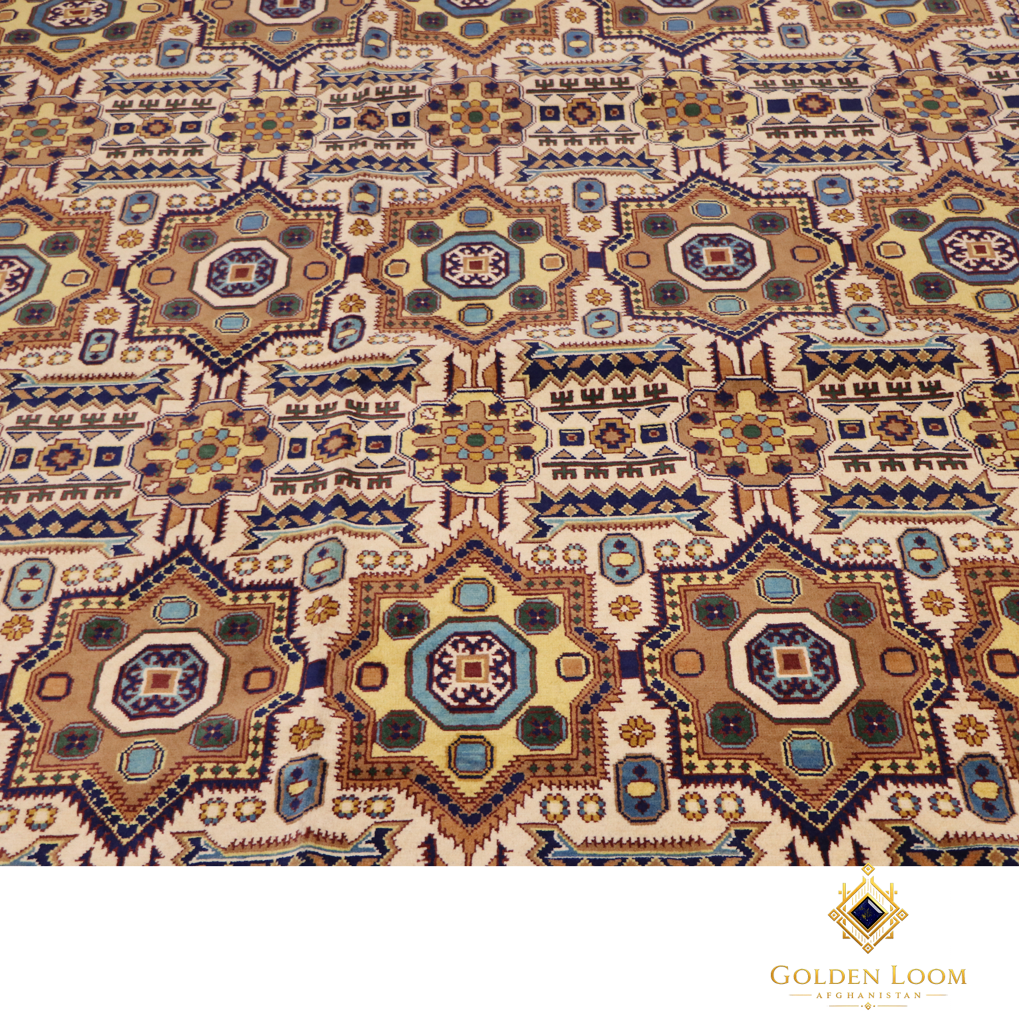 Close-up of Afghan Mamluk hand-knotted rug pile showing repeating octagonal medallion pattern in ivory, teal, gold and navy on wool foundation