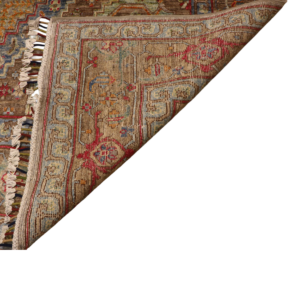 The Mazar-e-Sharif Chobi Wheat Legacy highlighting its hand-knotted pattern, natural wool and artisan craftsmanship.