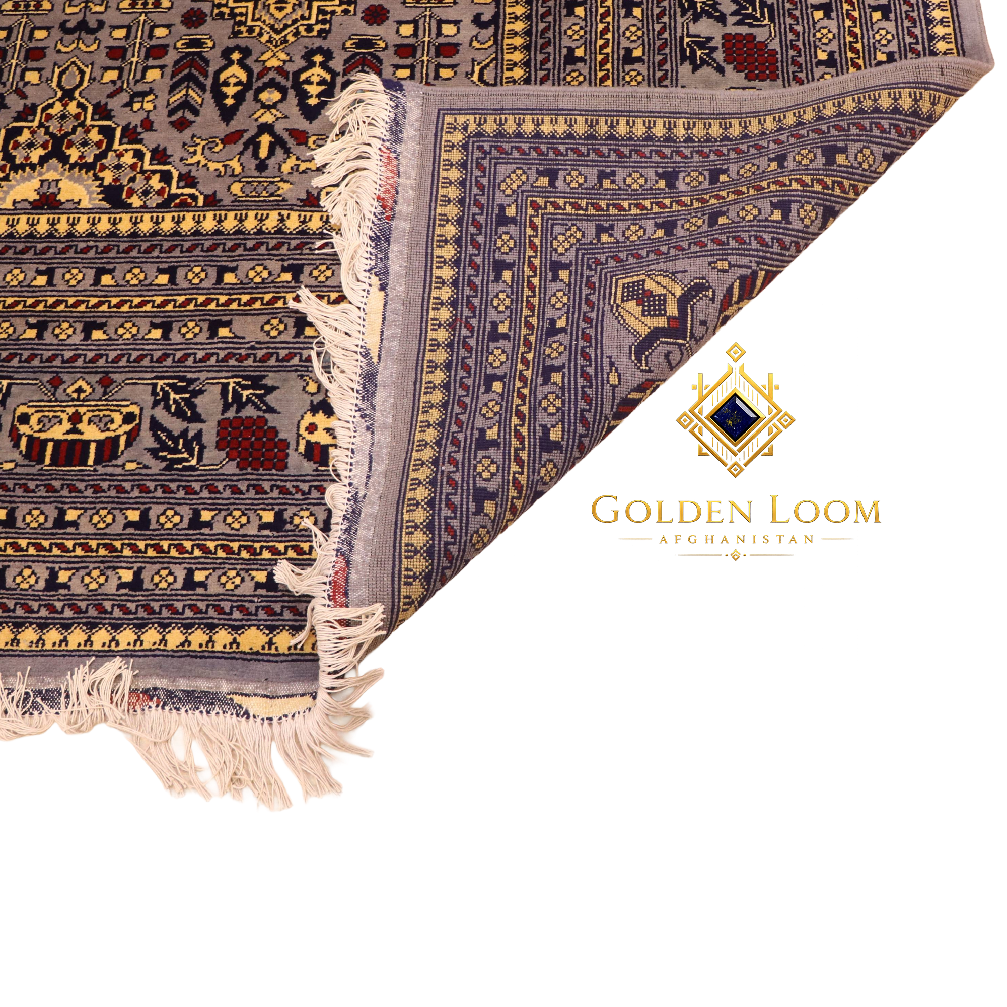 Close-up of hand-knotted Afghan carpet corner folded to reveal reverse weave, showing grey field with gold and navy floral motifs and ivory fringe