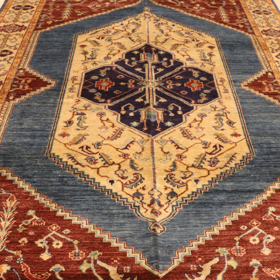 The Mazar-e-Sharif Kashan Lahori Legacy highlighting its hand-knotted pattern, natural wool and artisan craftsmanship.