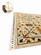Corner detail of hand-knotted Afghan carpet showing multicolor fringe, floral border, and ivory field, Golden Loom Afghanistan