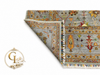 Chobi Sultani Diamond hand-knotted Afghan carpet with corner folded to reveal cotton back and tight knot structure, sage blue-grey pile with saffron cypress tree and botanical motifs, multicolor wool fringe, Golden Loom Afghanistan
