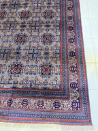 Detail shot of Afghan Bokhara rug showing silver grey field and coral red border – 100% natural wool