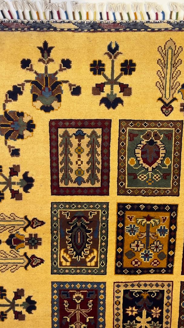 Real photo of hand-knotted Afghan Chobi rug showing golden field and multicolor mirror panels – crafted in Mazar-i-Sharif, Afghanistan