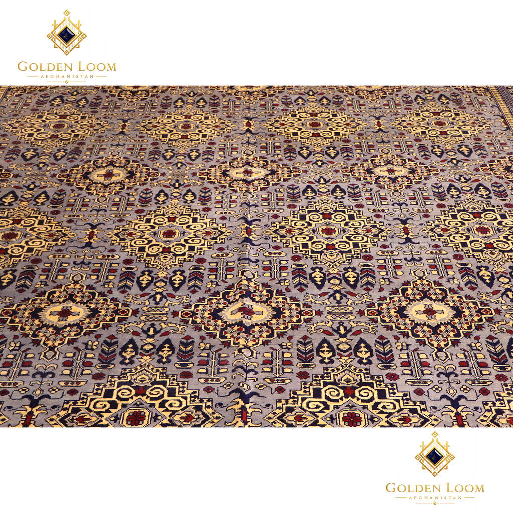 Overhead close-up of hand-knotted Afghan carpet field showing all-over repeating floral and medallion motifs in slate grey, gold, navy, and burgundy