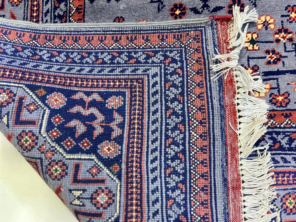 Close-up of hand-knotted wool knots on Afghan Bokhara rug – 40x40 knots per 10cm, crafted in Qarqin, Jawzjan